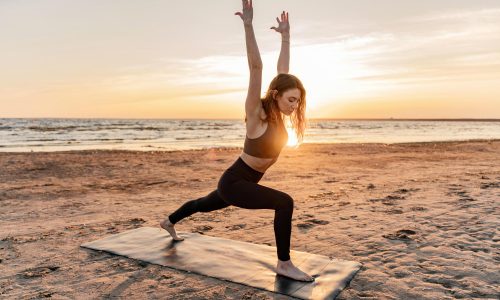trainer-is-slender-woman-with-beautiful-body-asana-exercise-uses-mat-sand